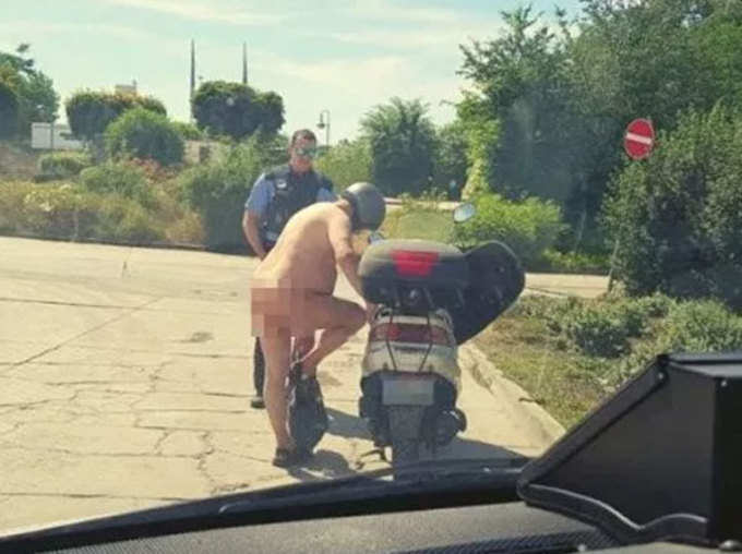 naked man riding scooter