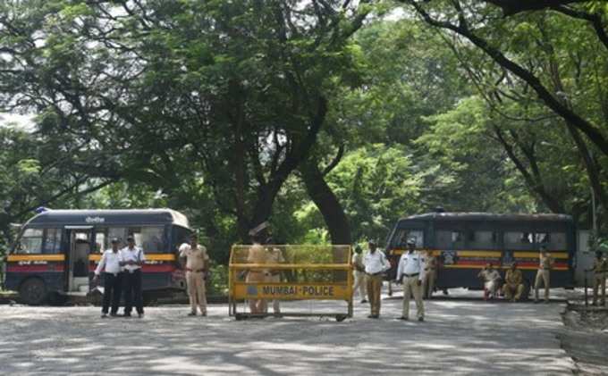 Mumbai: Police cordon off the area following a protest against the tree-cutting,...