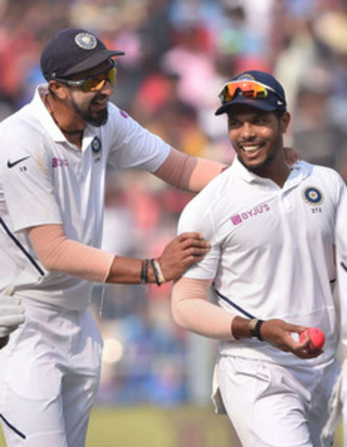 Kolkata: Indian pace bowler Umesh Yadav and Ishant Sharma celebrate after winnin...