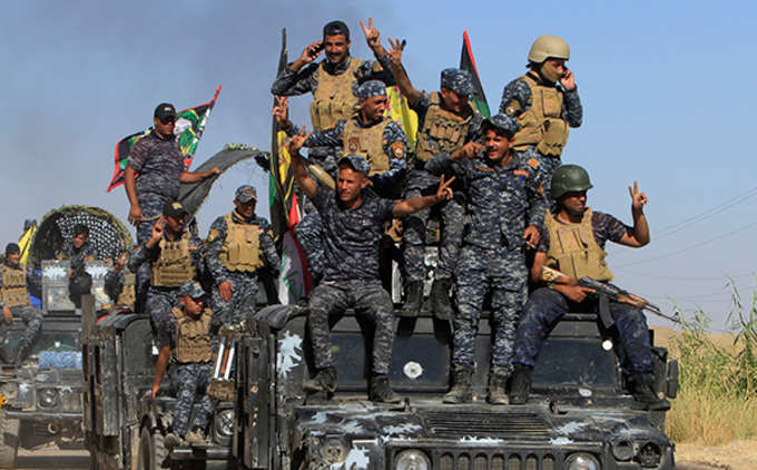 Iraqi forces advance on Kurdish-held area