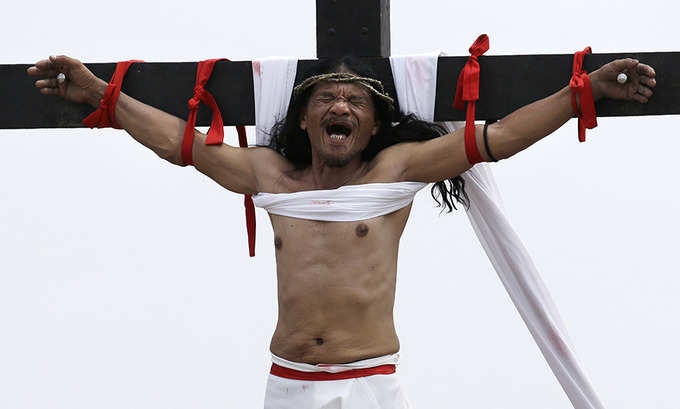 Good Friday: Devotees re-enact the crucifixion of Jesus Christ