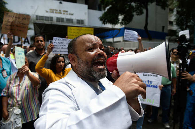 Venezuelans hold mass walkout against Maduro