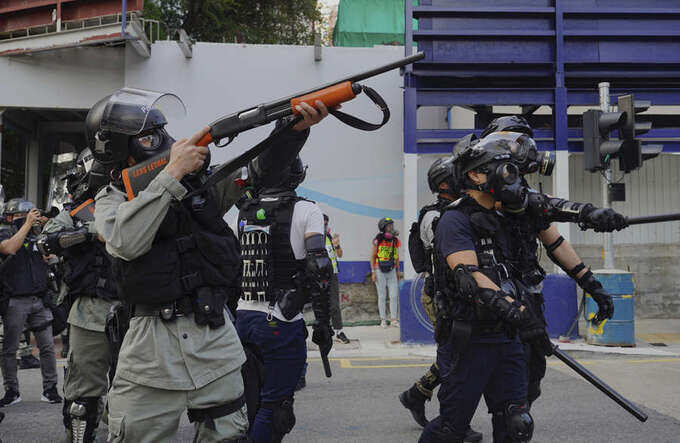 Hong Kong protesters hurl petrol bombs after police fire tear gas to clear rally