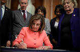 Nancy Pelosi signs impeachment articles against Trump