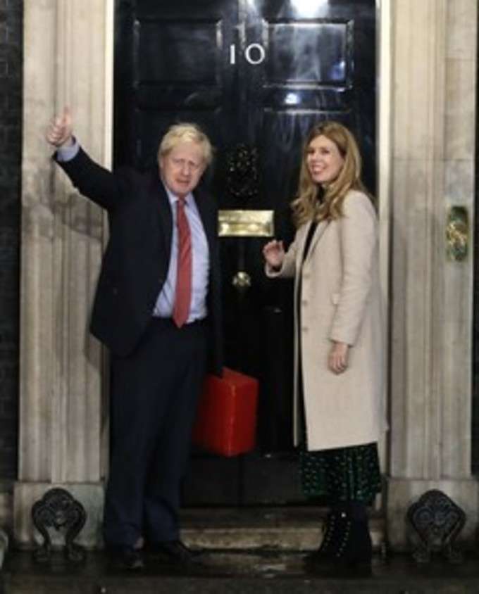 London: Britains Prime Minister Boris Johnson and his partner Carrie Symonds w...