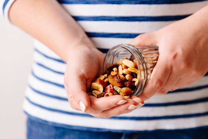 Nuts and dried fruits in hands