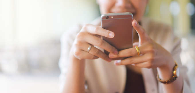 woman looking at smartphone