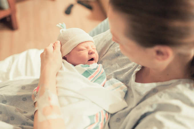 Mother holding her newborn baby