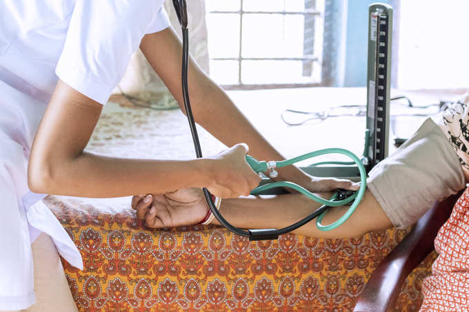 A nurse measuring blood pressure