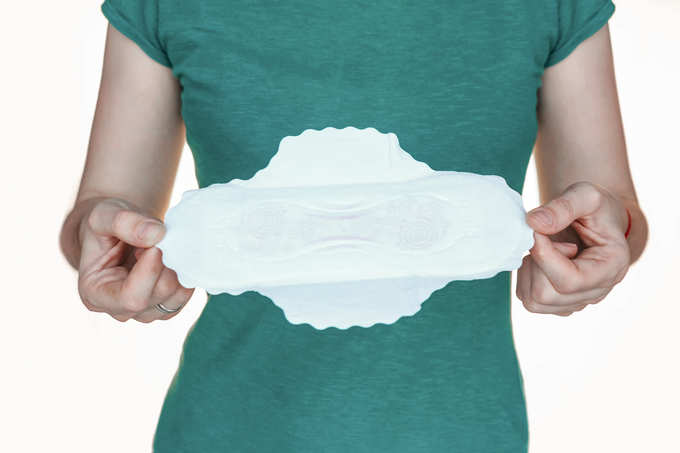 woman holding sanitary pad