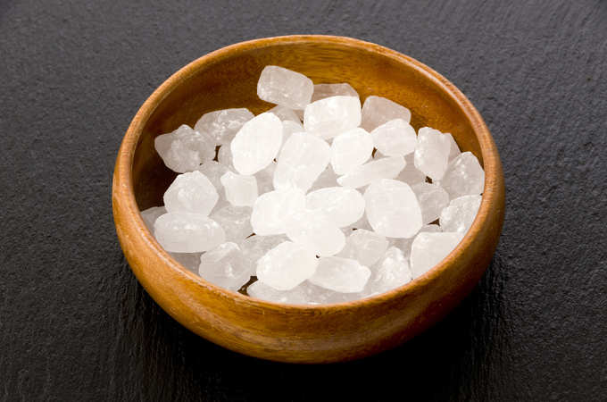 White rock sugar in a Round Wooden bowl