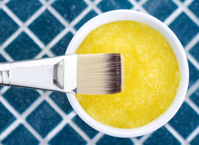 Yellow cosmetic mask (scrub) in a bowl