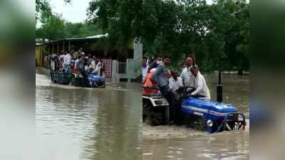 बारिश के बाद सड़क पर भरा पानी, मंत्री जी ने ट्रैक्टर से पार किया सैलाब