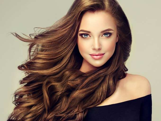 young-brown-haired-beautiful-model-with-long-curly-well-groomed-hair-picture-id1009066526