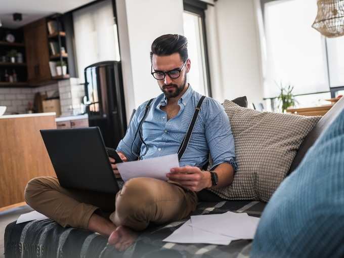 modern-bearded-young-businessman-working-on-laptop-computer-while-on-picture-id1141259759 (1)