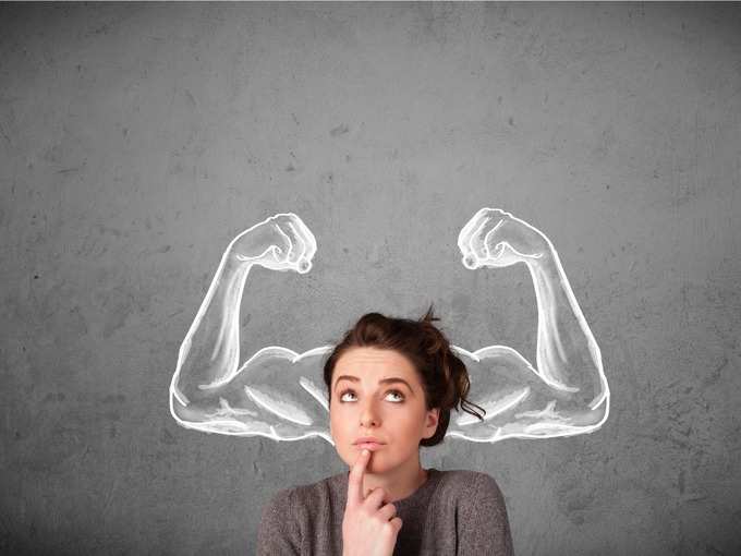 young-woman-with-strong-muscled-arms-picture-id1010610662