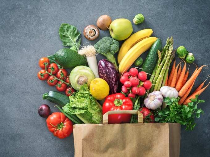 shopping-bag-full-of-fresh-vegetables-and-fruits-picture-id1128687123