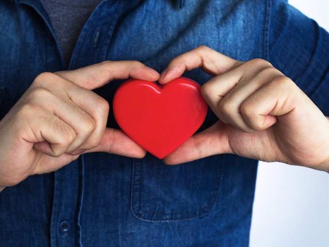 young-man-has-a-red-heart-shape-on-his-chest-by-hand-picture-id847037108