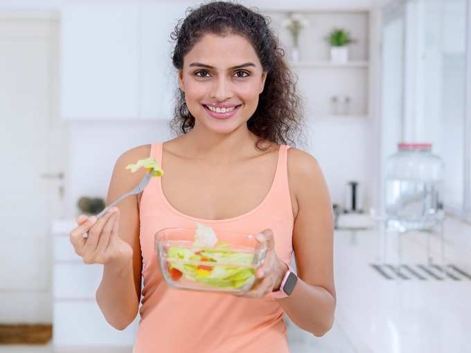 beautiful-woman-fresh-salad-in-the-kitchen-picture-id1095830250 (1)