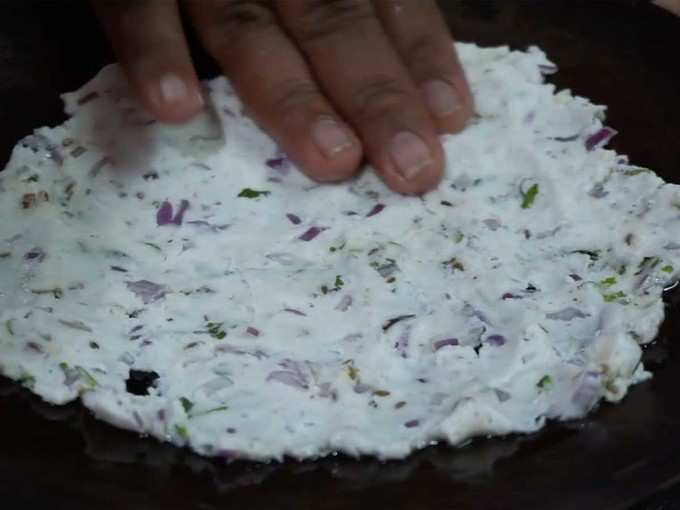 flatten the dough on the tawa