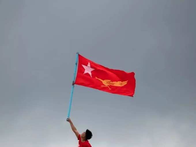 FILE PHOTO_ Supporters of National League for Democracy party take part in a boat rally ahead of a November 8 general election, in the Yangon river.