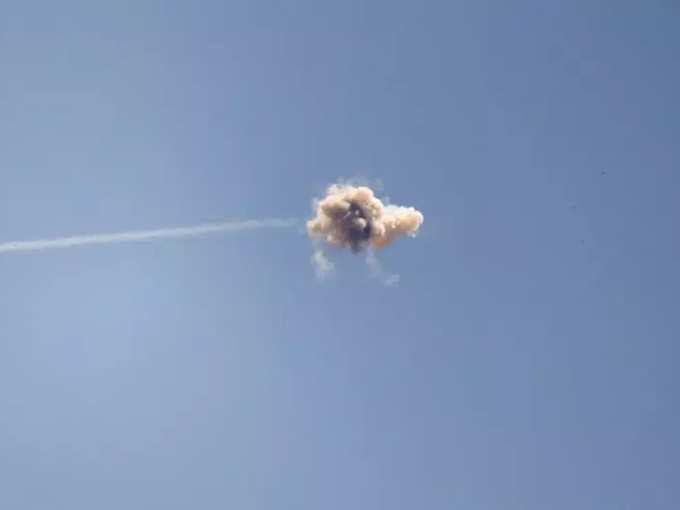 An explosion is seen midair as Israels Iron Dome anti-missile system intercepts a rocket launched from the Gaza Strip, as seen from near Sderot.