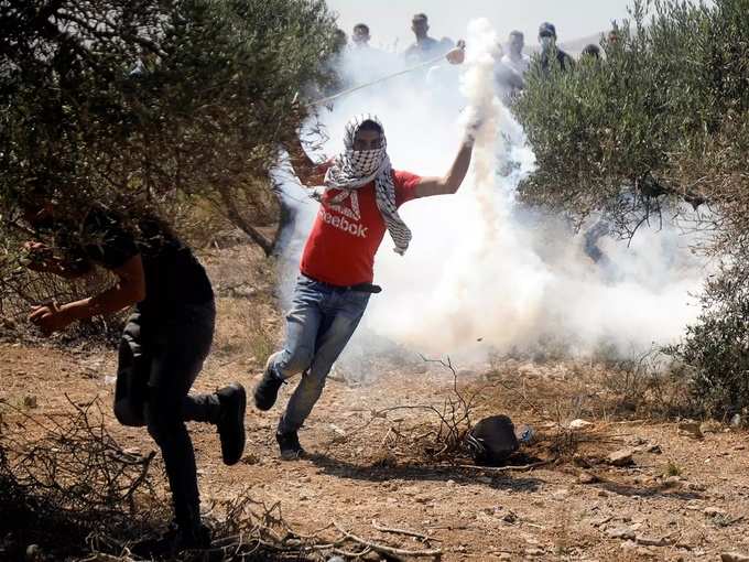 Palestinians protest against Israeli settlements, in West Bank (3).