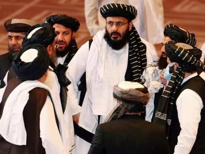 FILE PHOTO_ Taliban delegates speak during talks between the Afghan government and Taliban insurgents in Doha, Qatar.