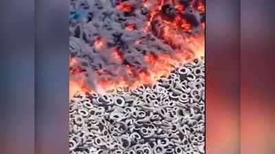 Watch: दुनिया में टायरों के सबसे बड़े कब्रिस्तान में लगी आग, अंतरिक्ष से नजर आए काले बादल