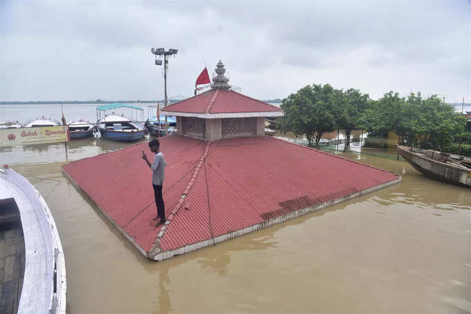 Varanasi: A nearly submerged temple at the bank of Ganga River, following heavy ...