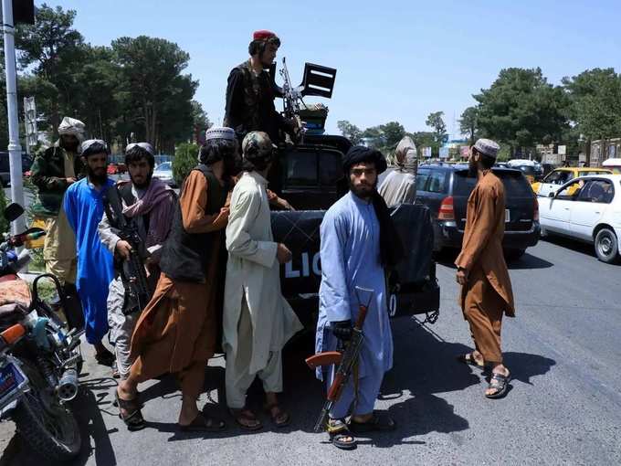 Taliban forces patrol a street in Herat (1).