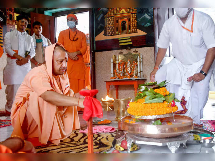 Gorakhpur: UP Chief Minister Yogi Adityanath performs a ritual during his visit ...
