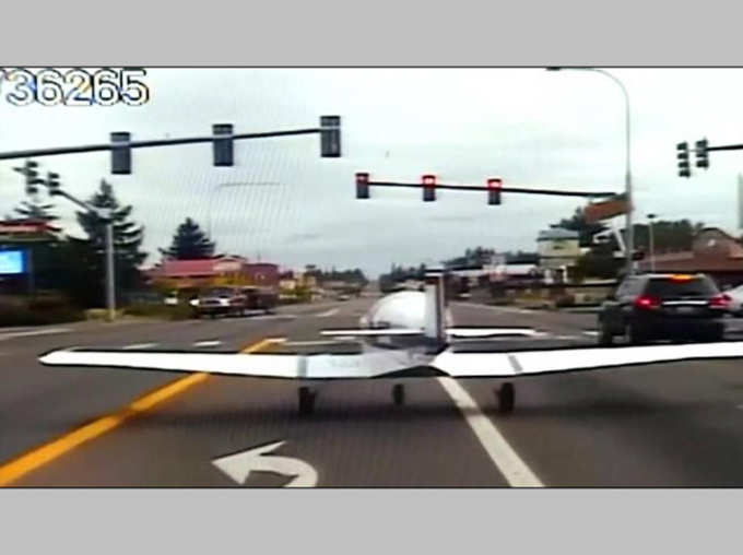 Plane Dramatic Emergency Landing On A Busy Road In The US Stops At Red Traffic Light Signal