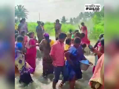 50 ஆண்டுகளுக்கு பின் நிரம்பிய ஏரி; பிரியாணி சமைத்தது பரிமாறிய கிராம மக்கள்