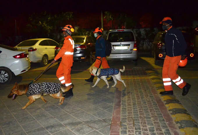 Gurugram: NDRF personnel carry out rescue operation after a portion of a buildin...