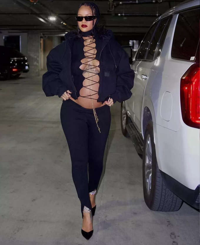 Pregnant Rihanna in bold lace-up top flaunts baby bump