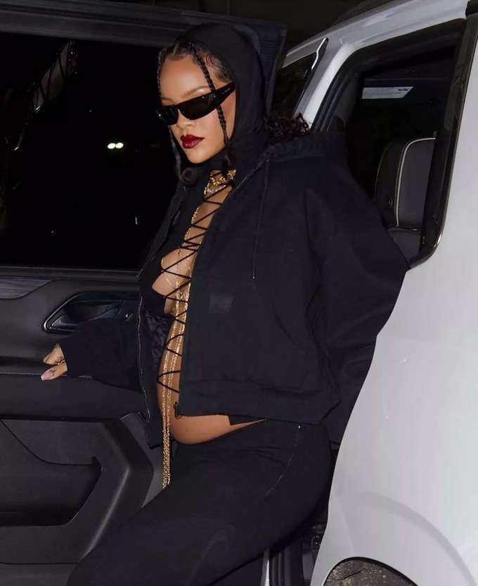 Pregnant Rihanna in bold lace-up top flaunts baby bump