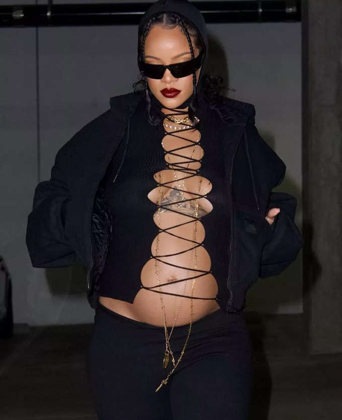 Pregnant Rihanna in bold lace-up top flaunts baby bump