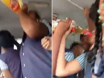 चलती बस में मुंह से बोतल लगाकर बीयर पीते छात्रों का वीडियो वायरल
