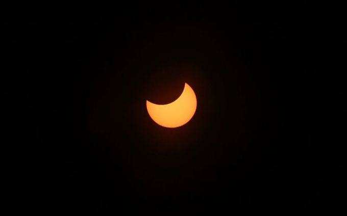 Partial solar eclipse is seen from Villarrica, Chile