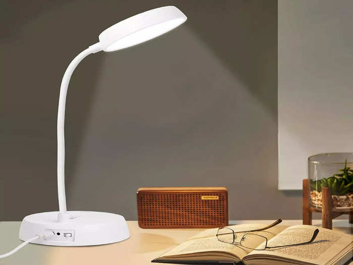 led lamp light on table with book