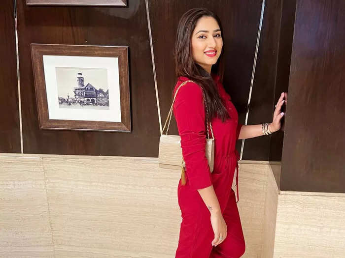 bigg boss fame rahul vaidya wife disha parmar looks fashionable in red jumpsuit for her latest photoshoot