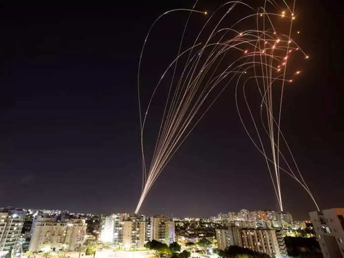 Streaks of light are seen as Israels Iron Dome anti-missile system intercepts rockets launched from the Gaza Strip towards Israel, as seen from Ashkelon, Israel.