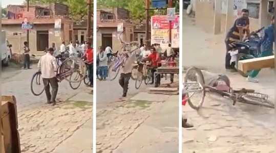 drunk man trying to ride on the bicycle is going viral on twitter