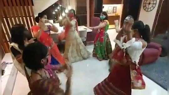 women with their masks on perform garba privately at a home in pune