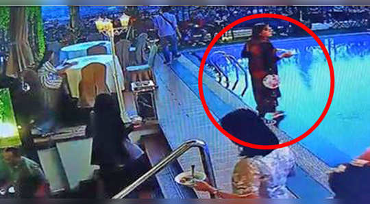 watch funny video of woman falls into a pool while having breakfast buffet in hotel fail