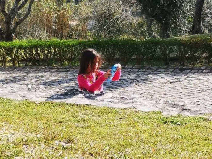 viral photo showing girl sinking into ground spooky optical illusion baffles internet