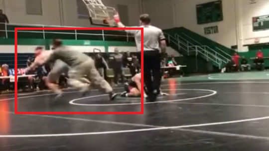 video of a man tackling sons opponent in school wrestling match is going viral