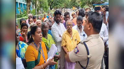 கிராம நிர்வாக அலுவலரை பணி நீக்கம் செய்ய வேண்டும்- காஞ்சிபுரம் ஆட்சியர் அலுவலகத்தில் கிராம மக்கள் குவிந்ததால் பரபரப்பு