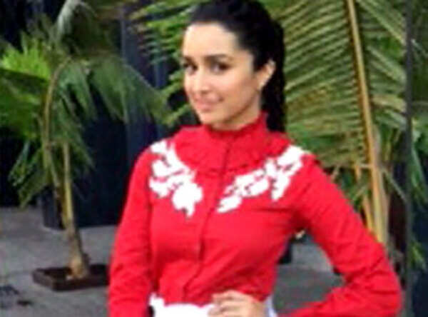 check out shraddha kapoor in a red turtleneck shirt